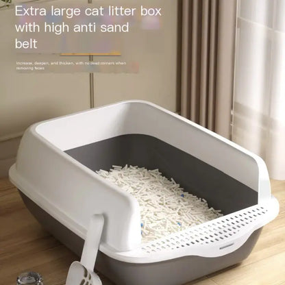 Extra large cat litter box with high anti-sand belt on a wooden floor.